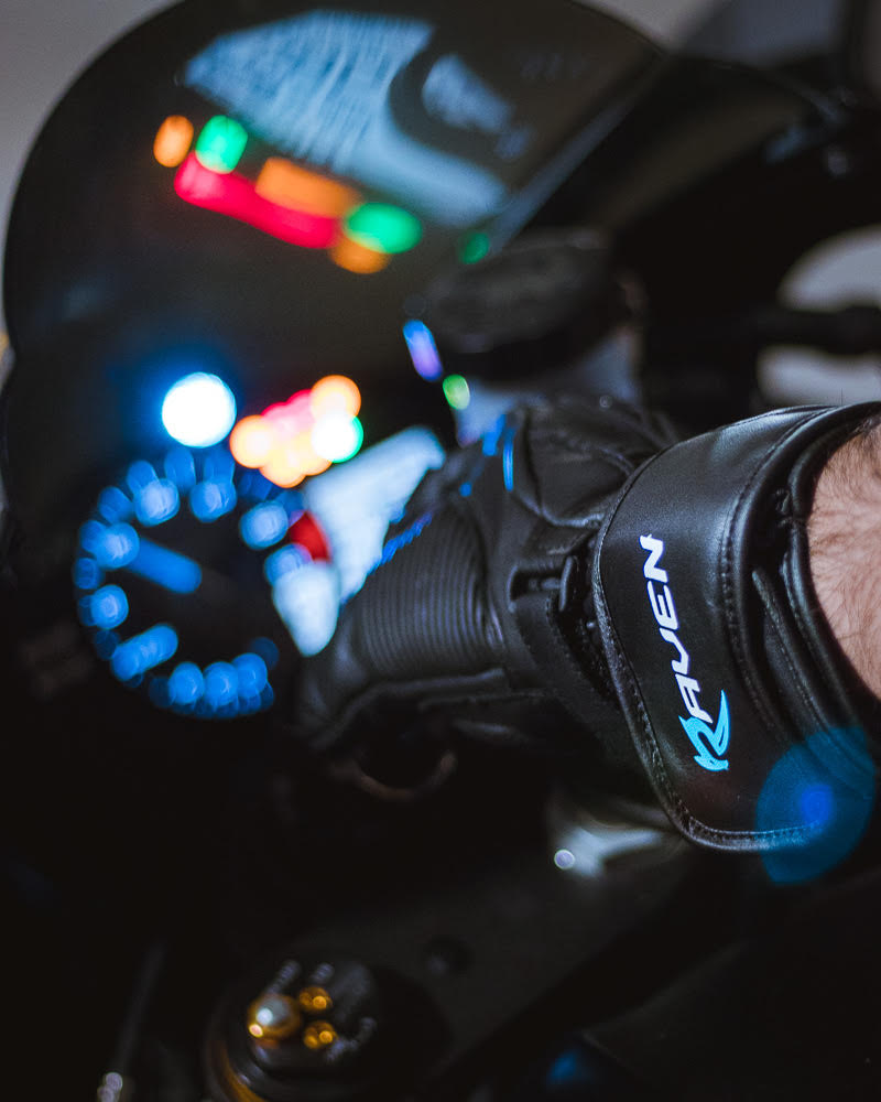 A motorcycle rider wearing RAVEN Moto DARK STORM leather gloves ready to start his Yamaha motorcycle