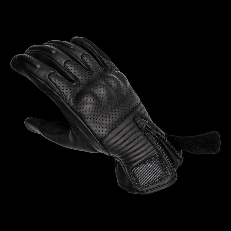 A short-cuff cowhide leather motorcycle glove made by RAVEN Moto, with a hook and loop fastener and zipper enclosure